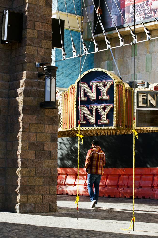 The New York - New York Hotel & Casino marquee entrance sign is readied to be taken down by Yesco and donated to the Neon Museum on Tuesday, Jan. 7, 2014.